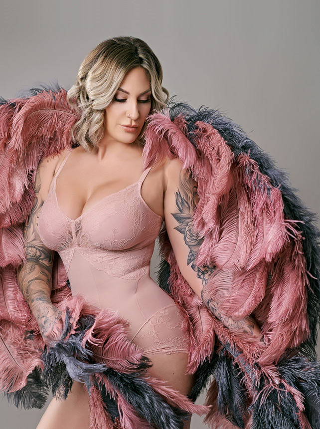 Glam studio portrait of a woman in lace with a feather wrap, Ocala signature portraits