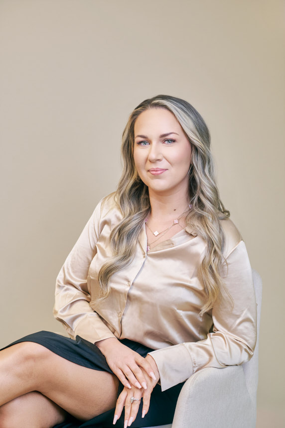 Lifestyle branding portrait of a spa owner relaxing with tea on a couch