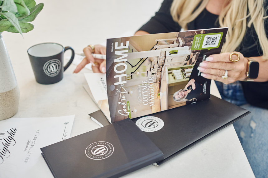 Ashley Yates Realty magazine and branded marketing materials styled during an Ocala real estate brand photography session